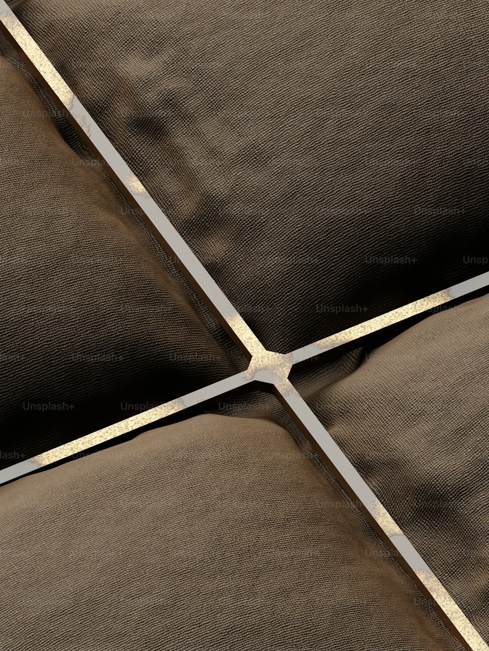 a close up of a brown and white pillow