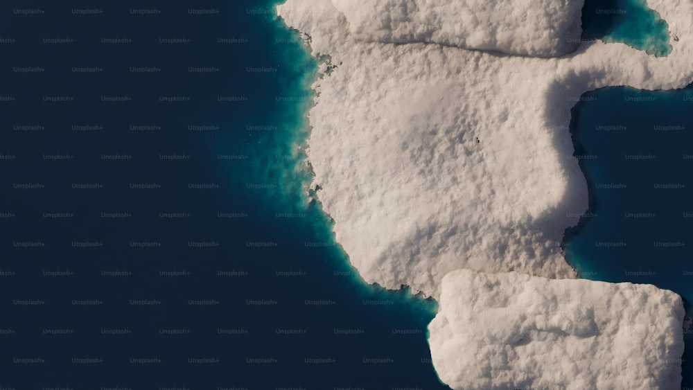 an iceberg floating in the middle of the ocean