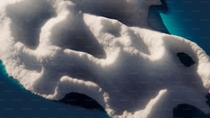 an aerial view of a snow covered mountain