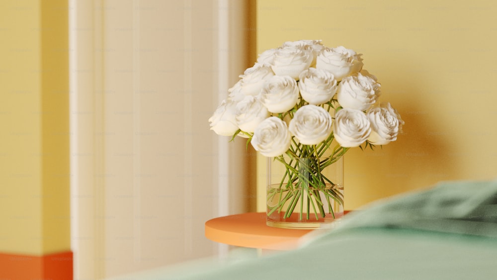 a vase of white flowers sitting on a table