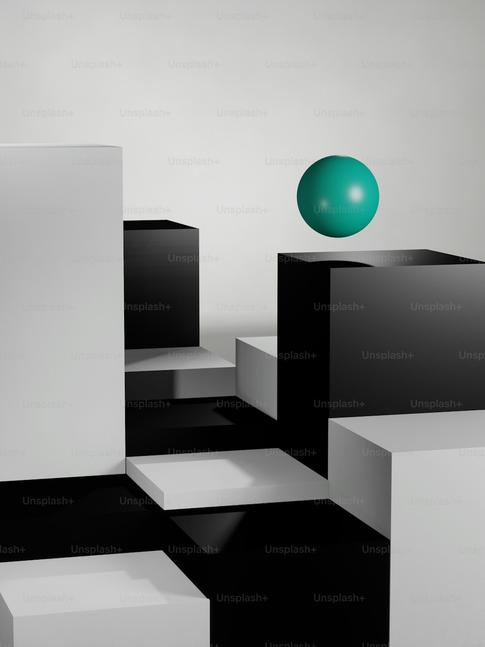Ein grüner Ball sitzt auf einer schwarz-weißen Box
