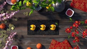 un tavolo di legno sormontato da arance e fiori
