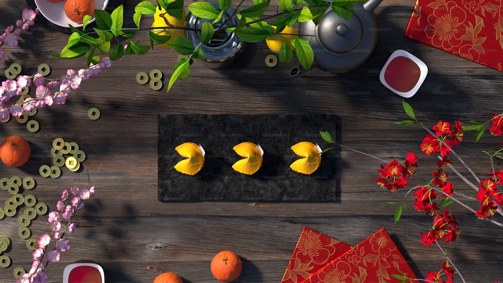 a wooden table topped with oranges and flowers