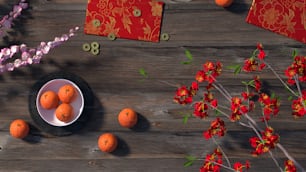 eine Schale Orangen auf einem Holztisch