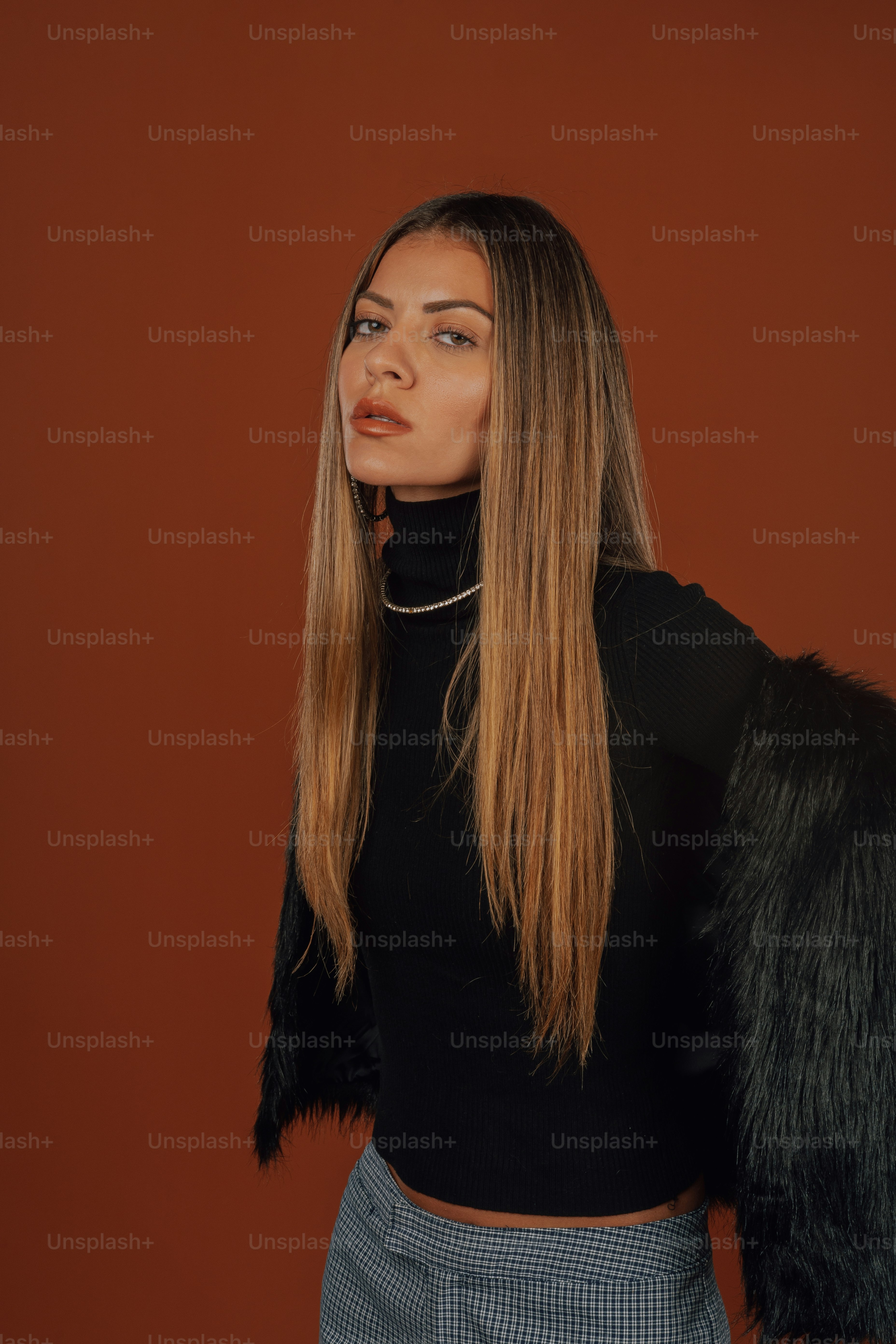 a woman with long hair wearing a black top