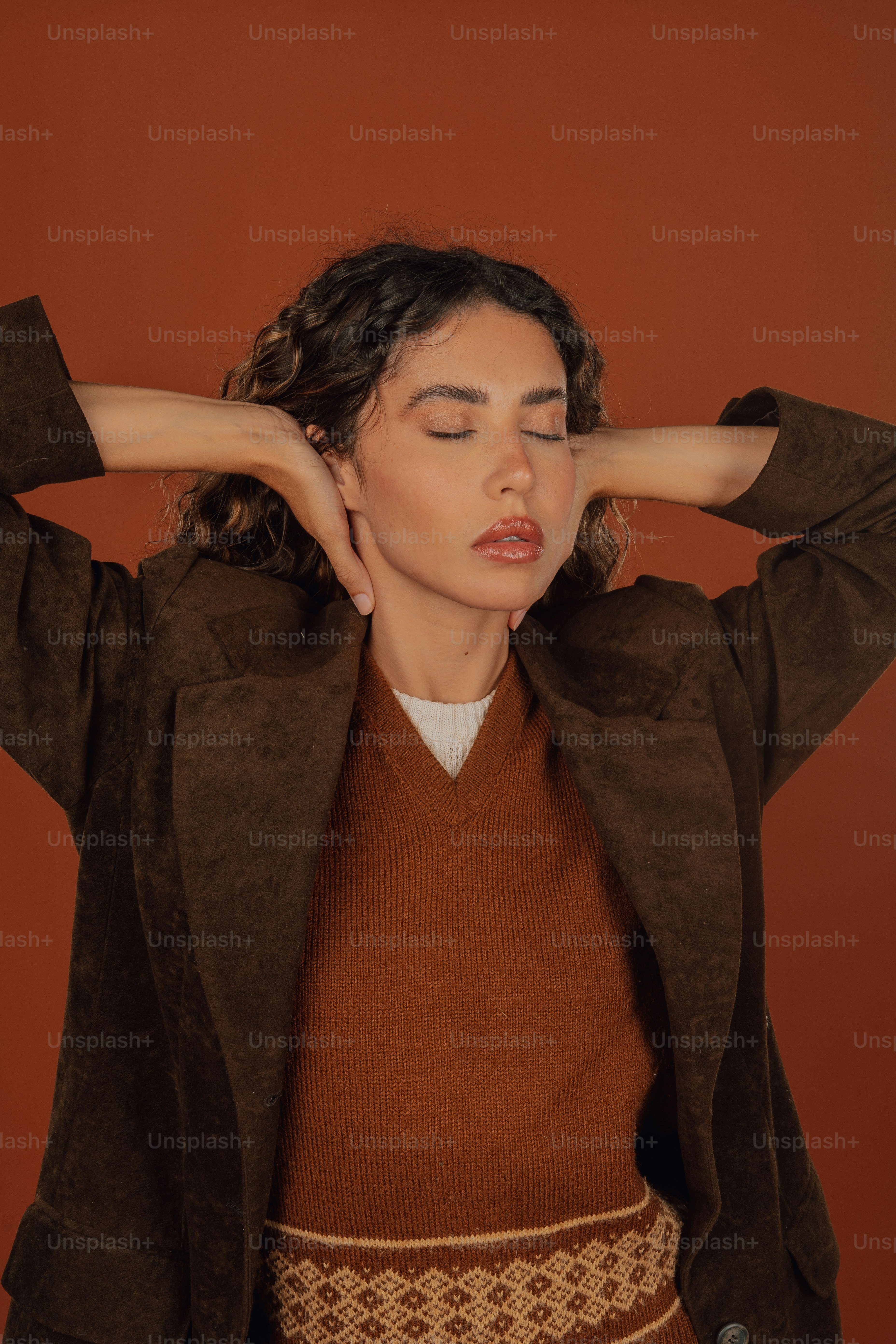 a woman with her hands on her head