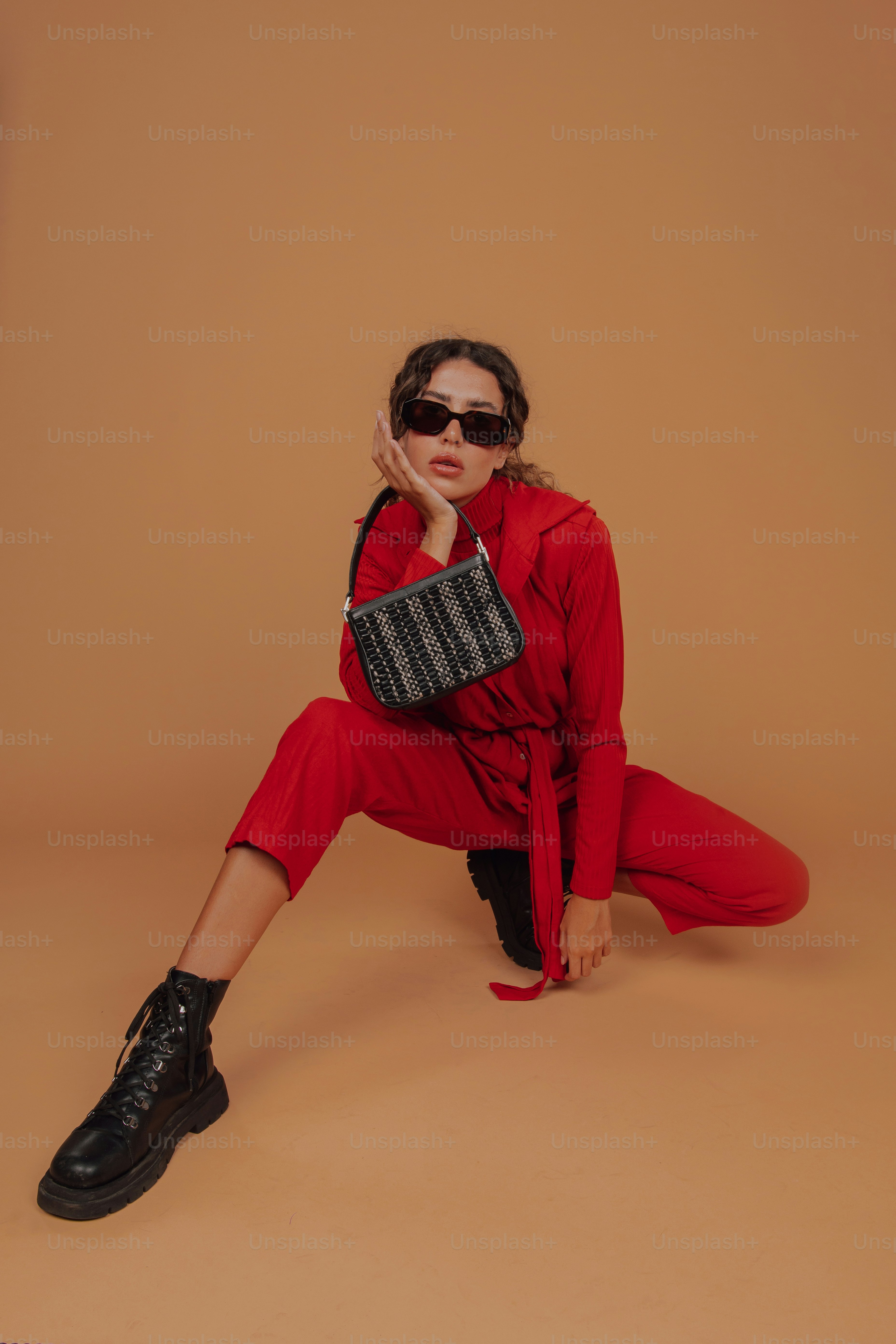 a woman in a red outfit and black shoes