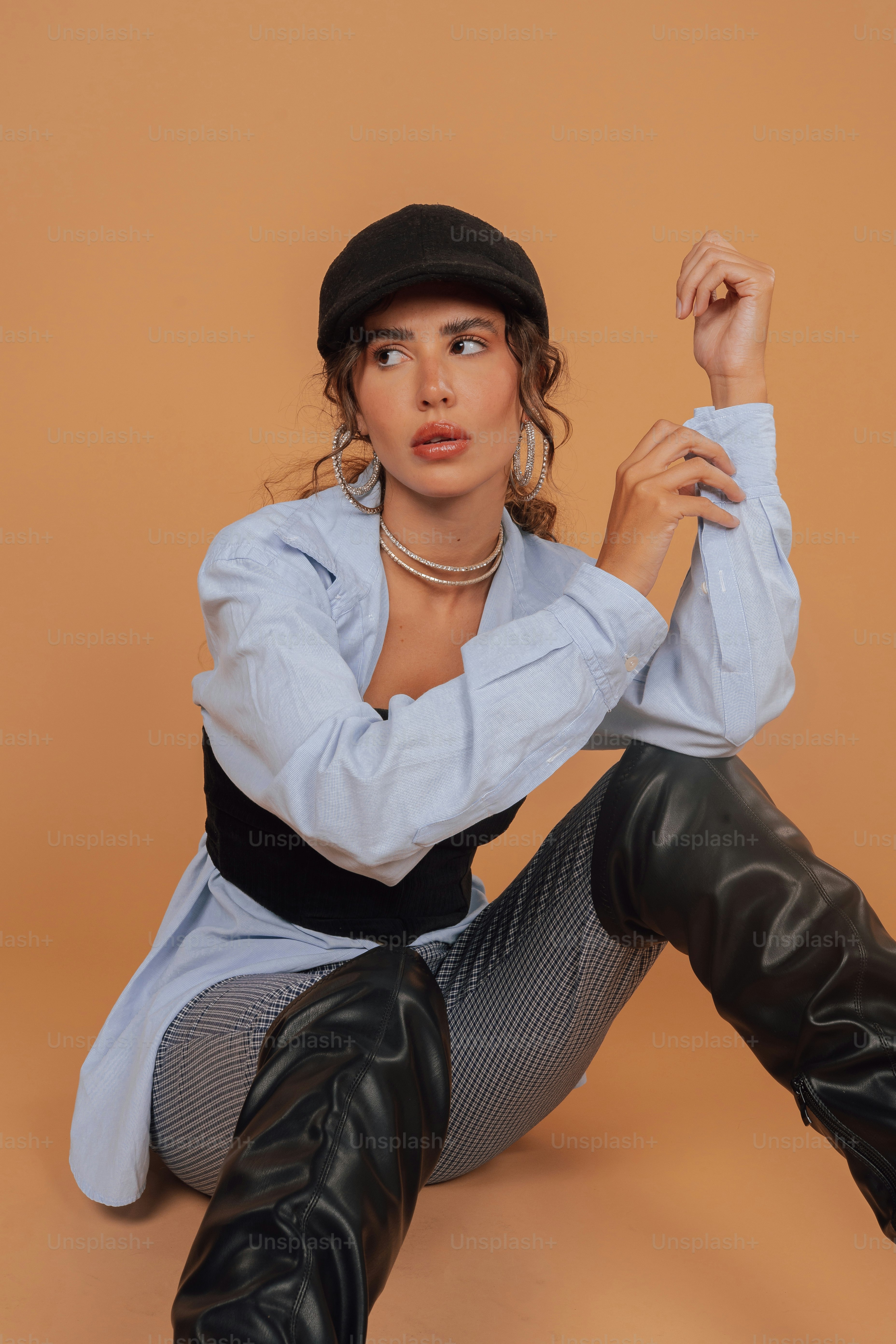 a woman sitting on the floor with her legs crossed