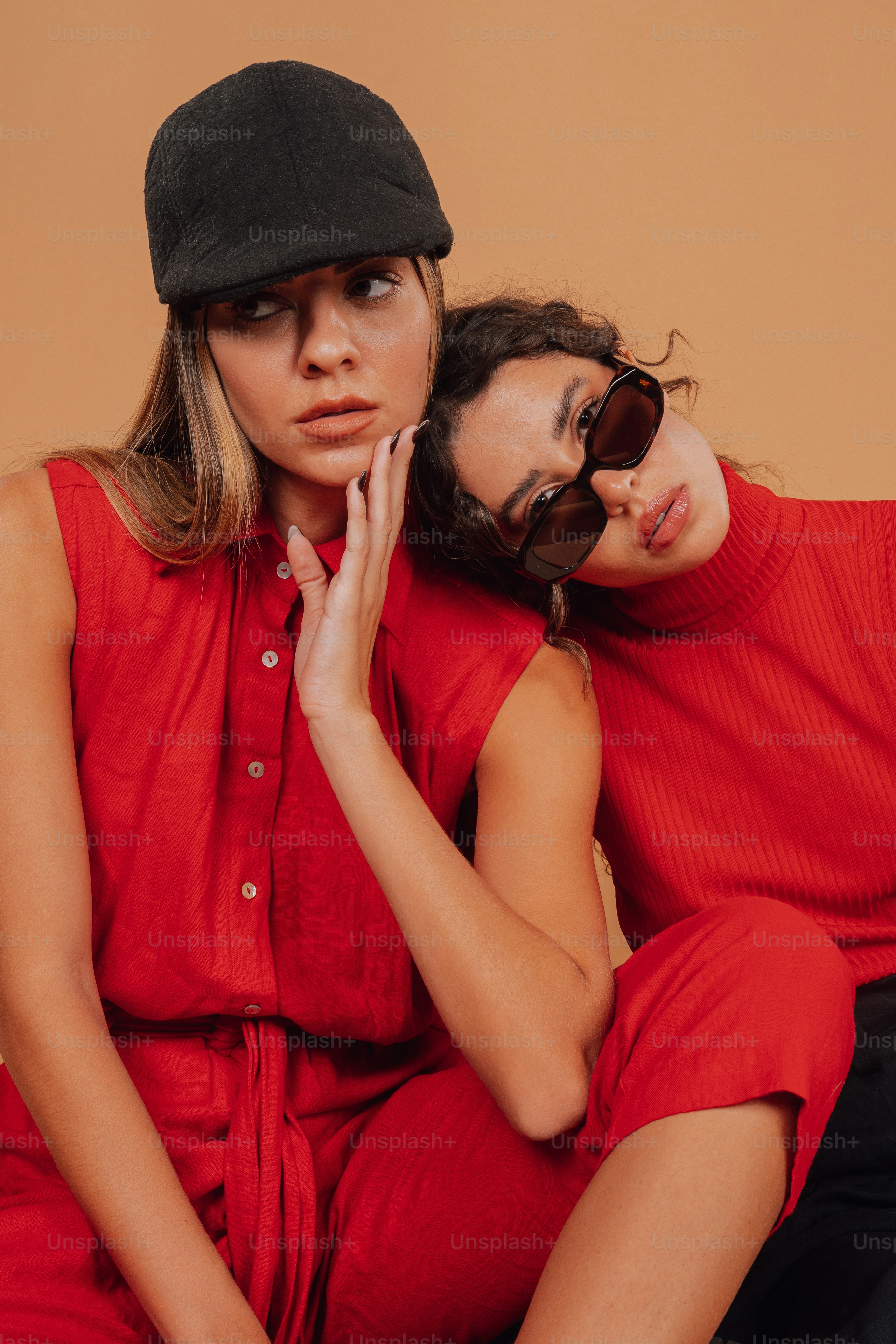 a couple of women sitting next to each other