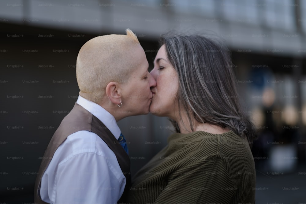 a man and a woman kissing each other