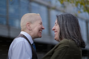 a man and a woman smiling at each other