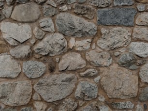 a close up of a stone wall made of rocks