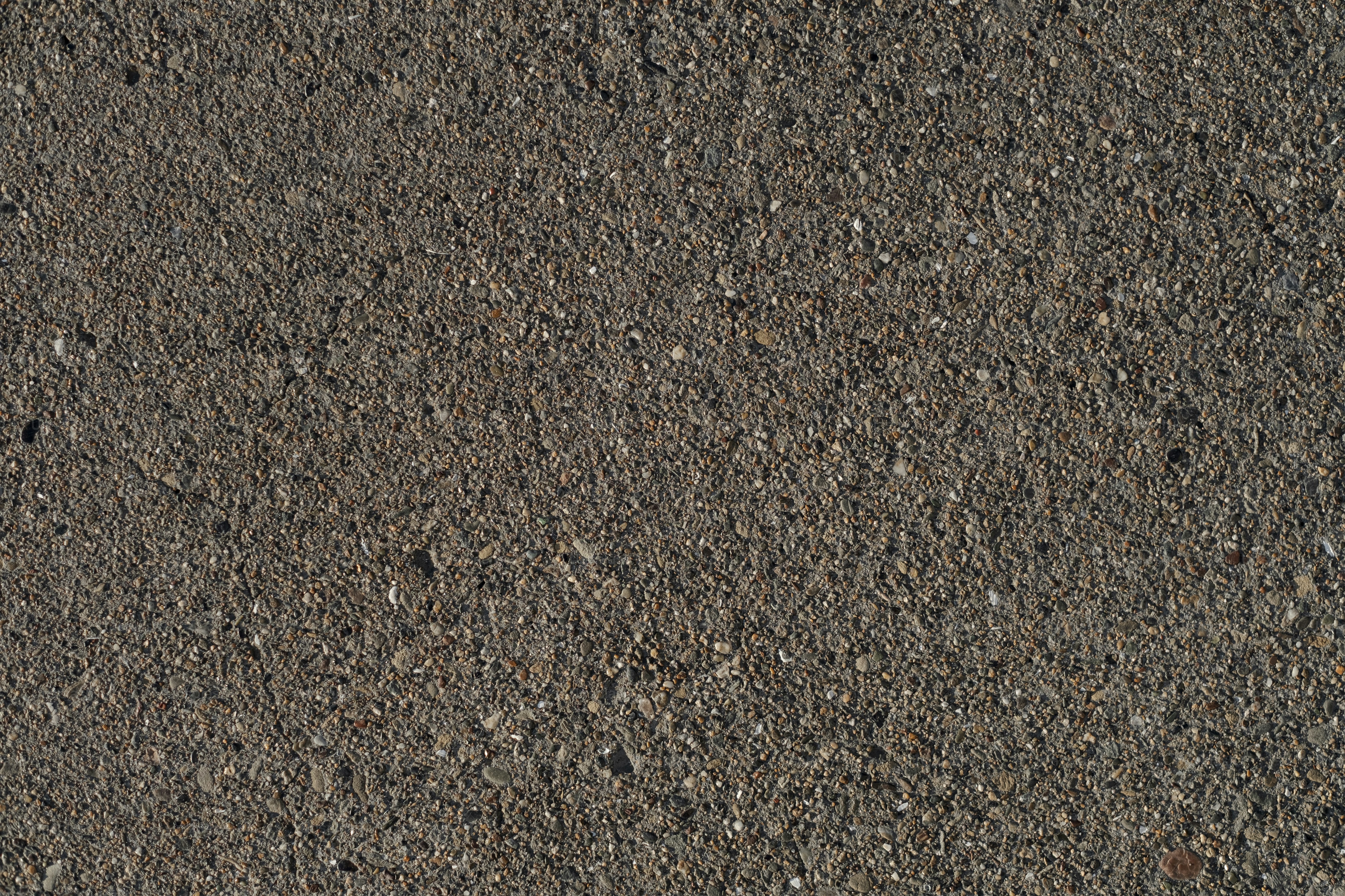 a red stop sign sitting on the side of a road