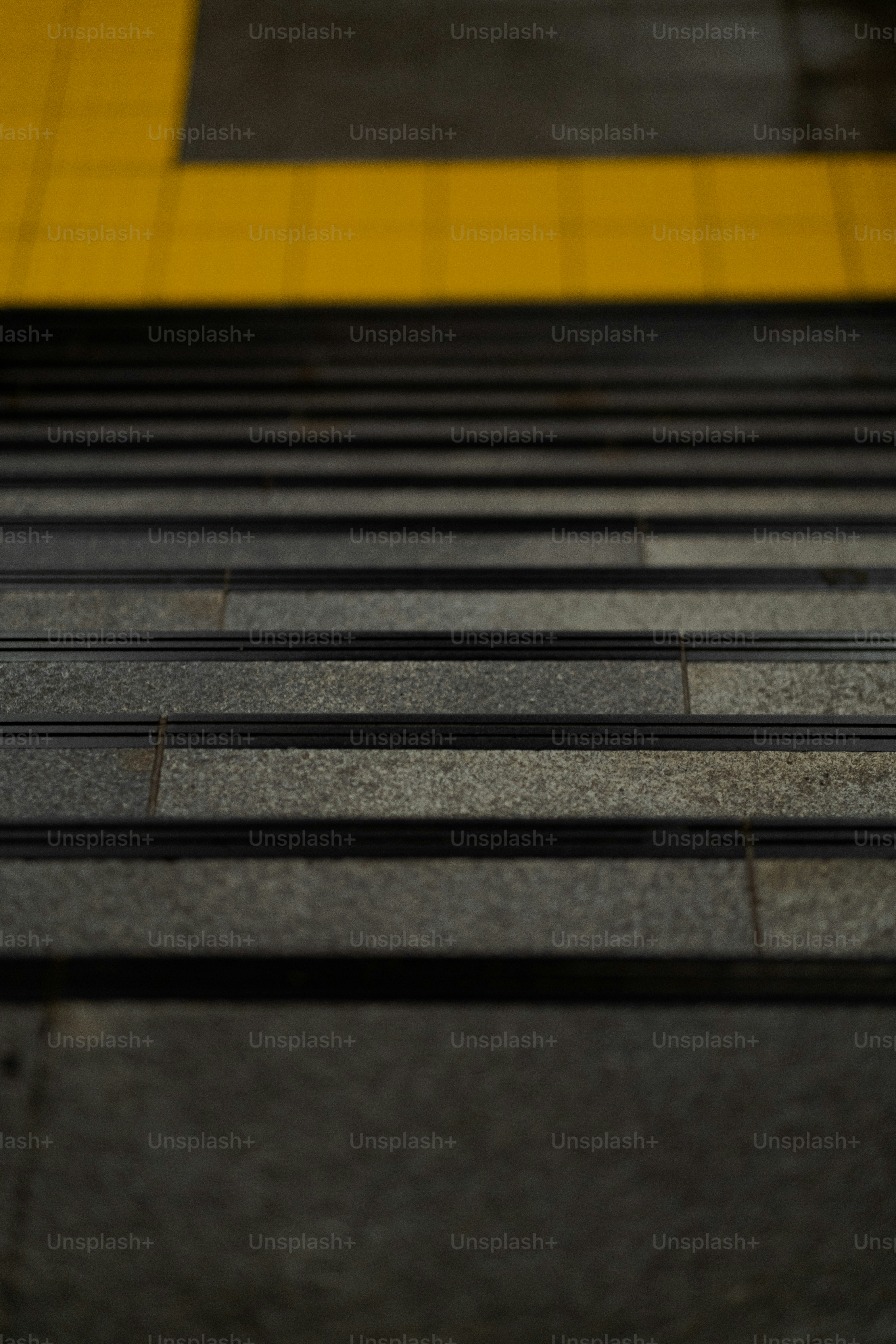 a close up of a bench on a city street