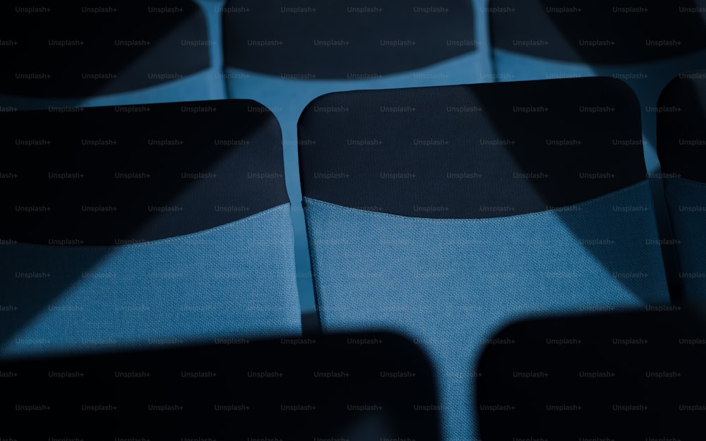 a close up of a blue and black chair