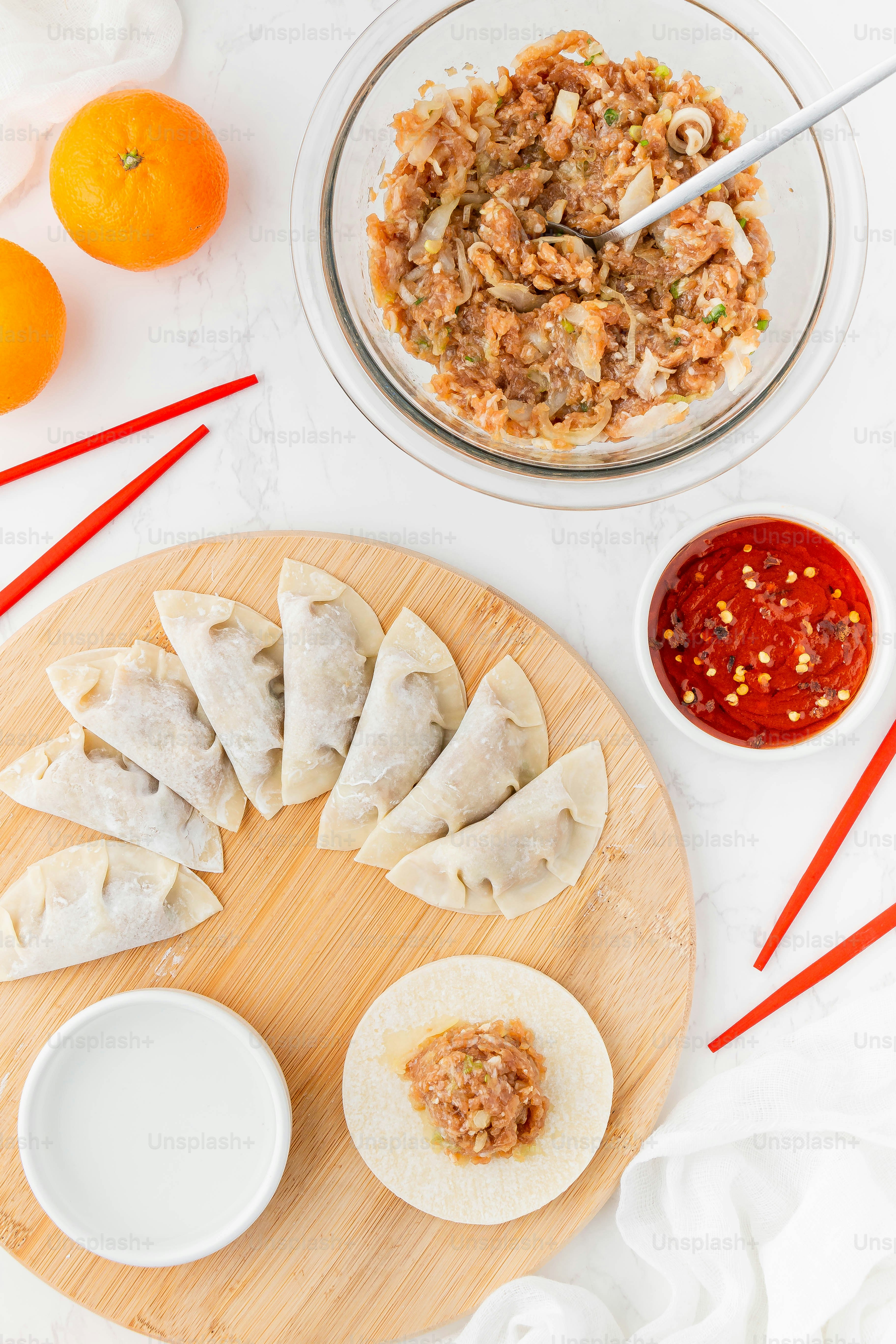 a plate of food on a table with chopsticks