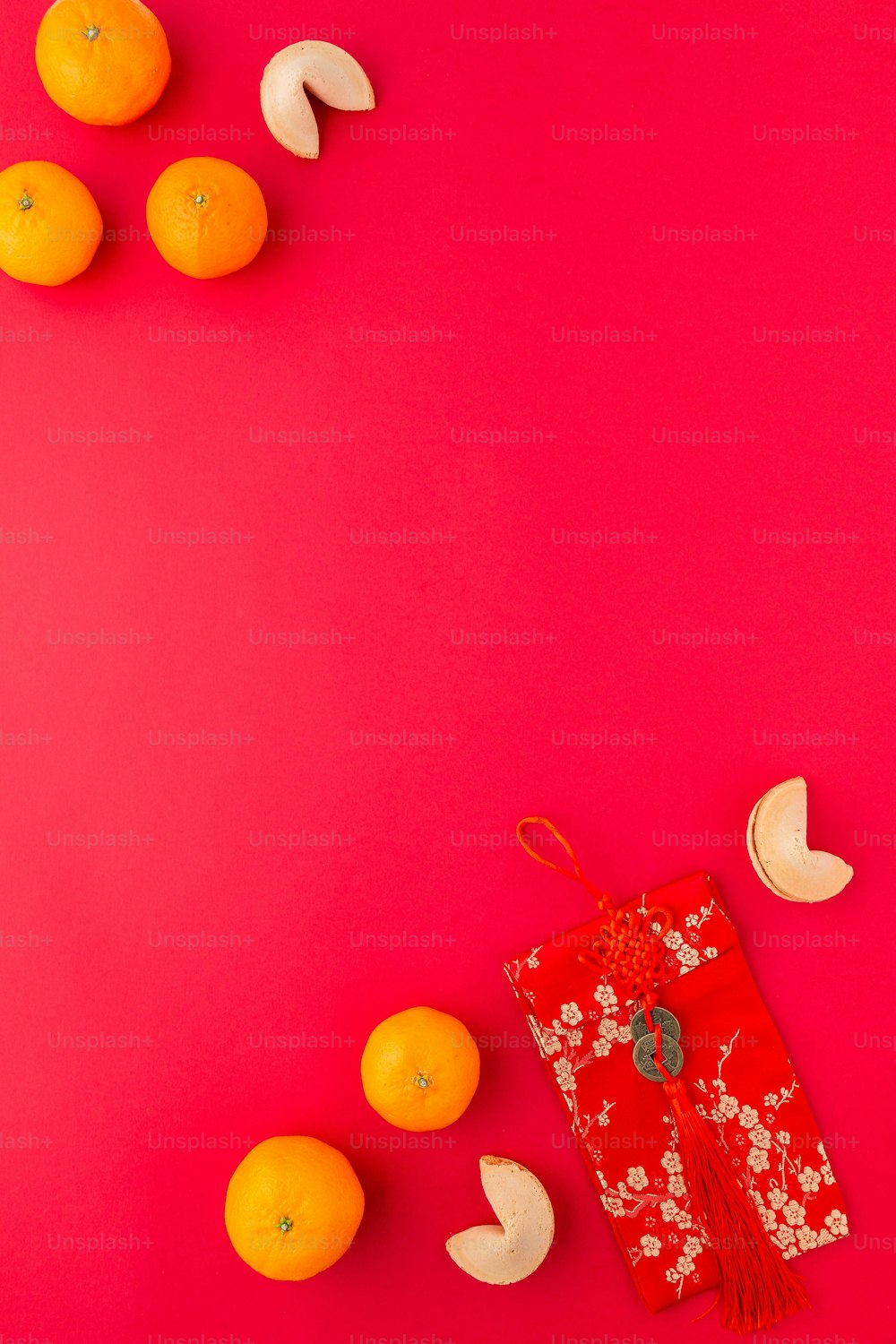 oranges, bananas, and an orange on a pink background