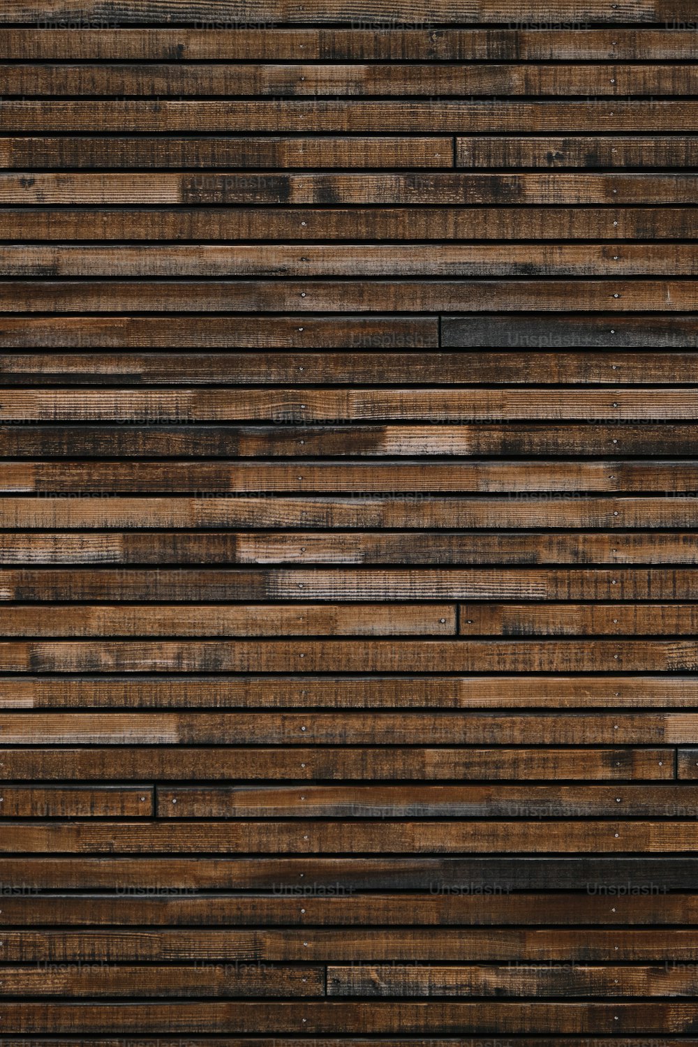 a close up of a wall made of wood planks