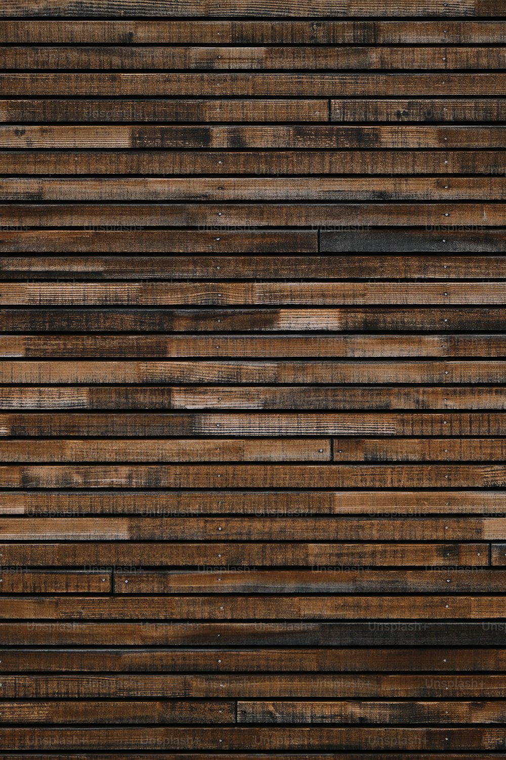 a close up of a wall made of wood planks