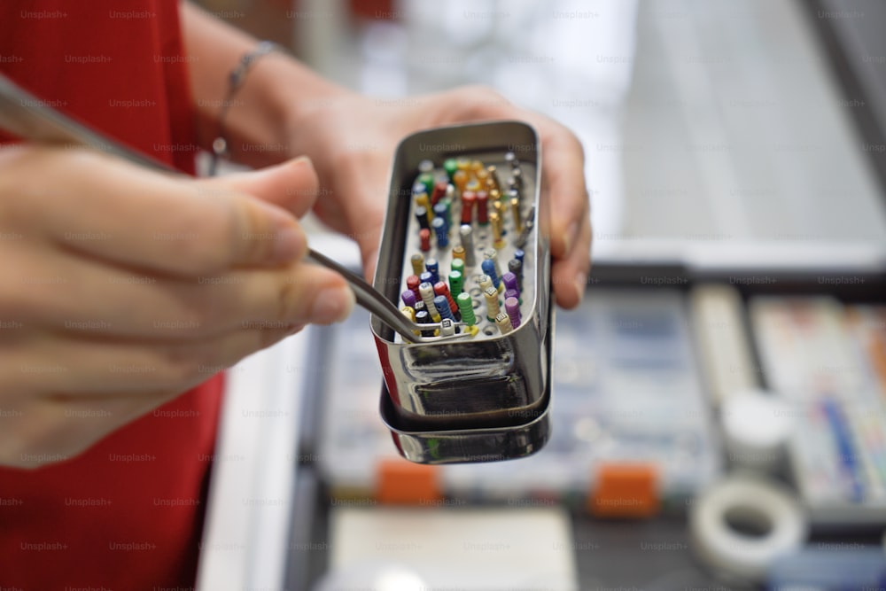 a person holding a cell phone in their hand