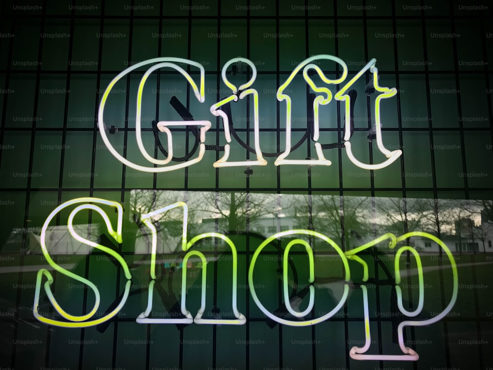 a neon sign that says girl shop on it