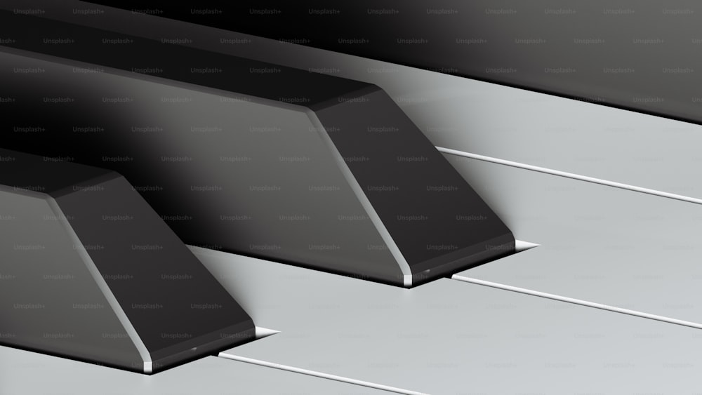 a close up of a black and white piano keys