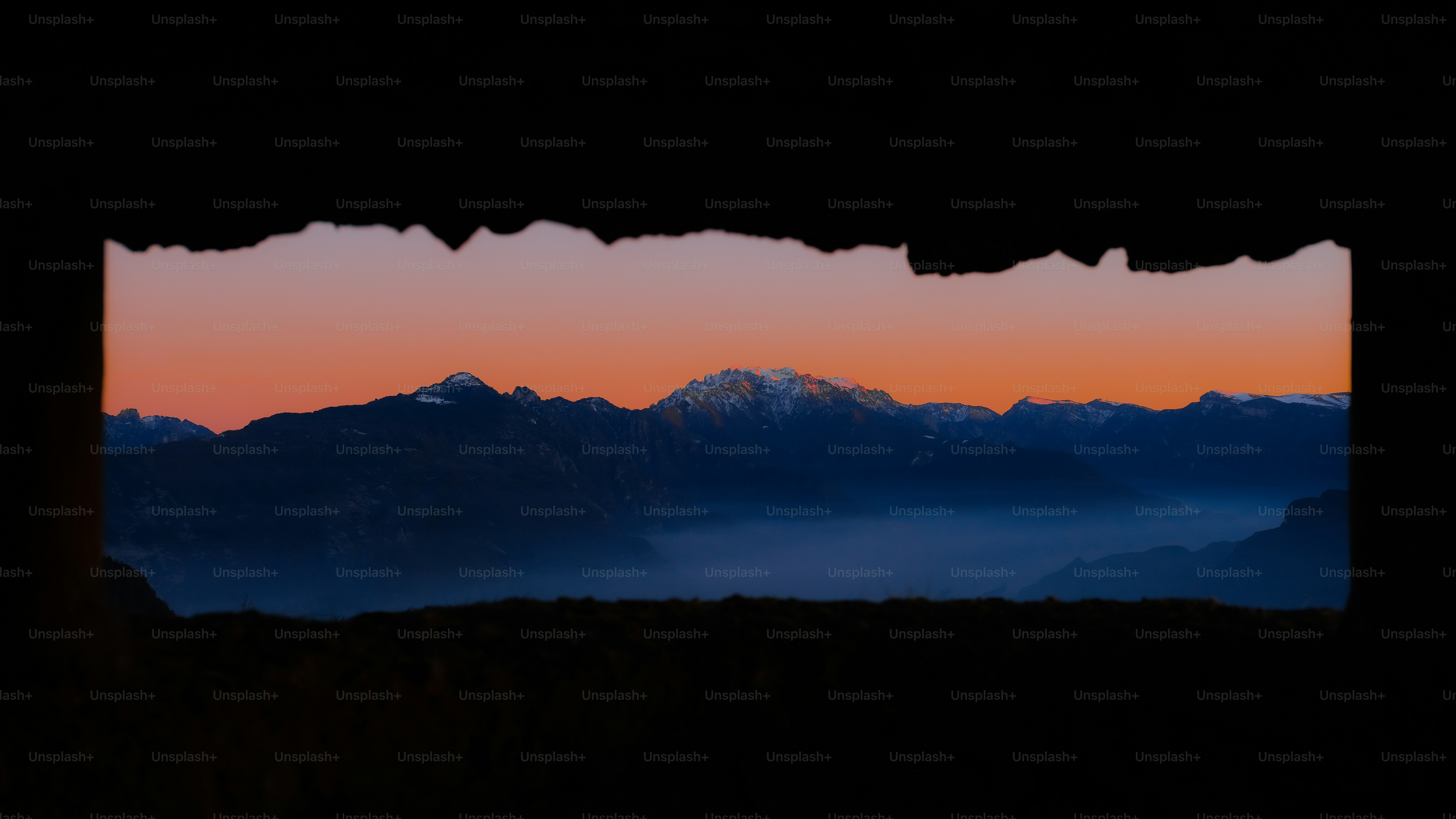 a view of a mountain range through a window