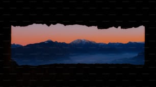 a view of a mountain range through a window