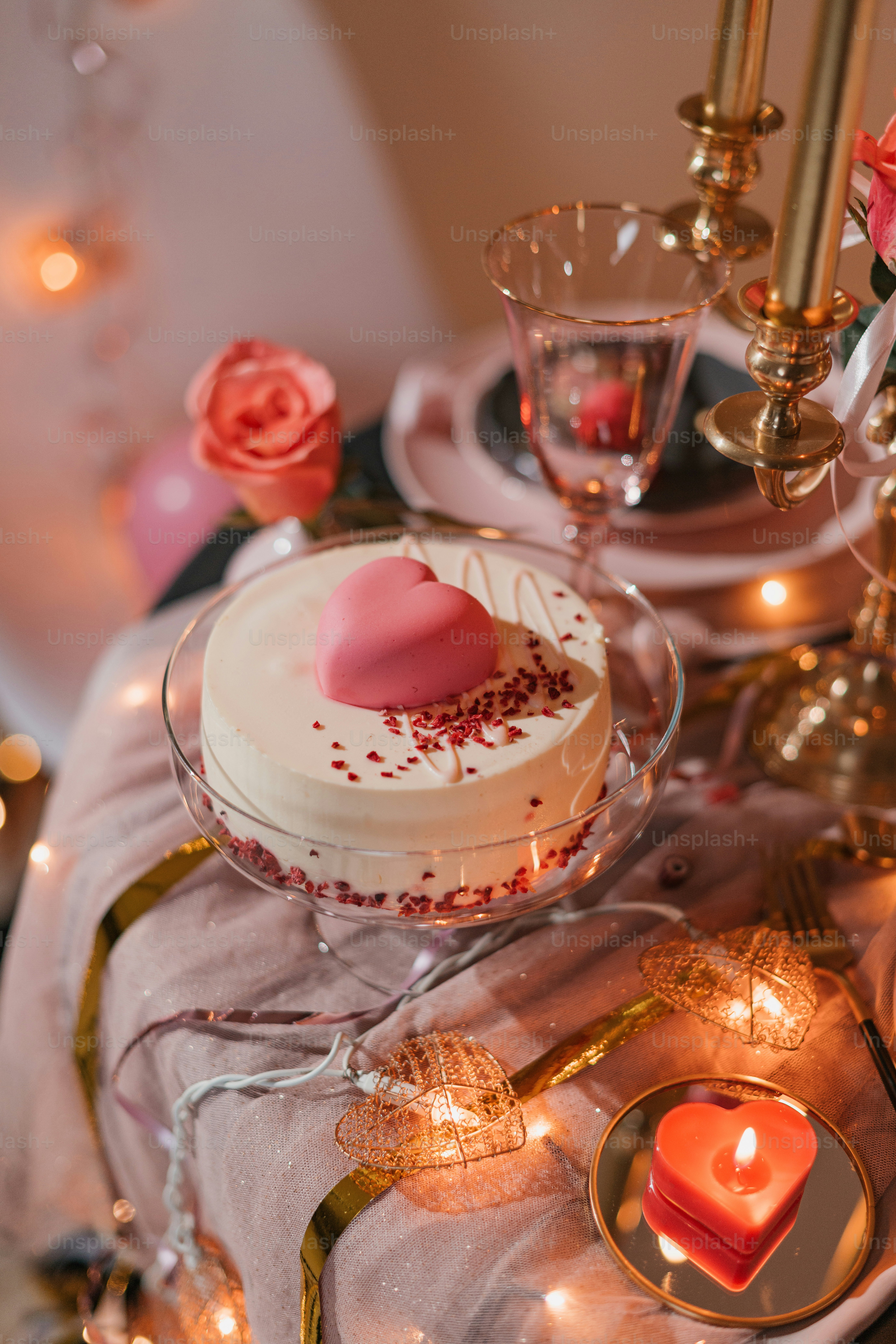 a table topped with a cake covered in frosting