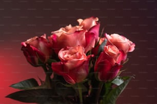a bunch of pink roses in a vase
