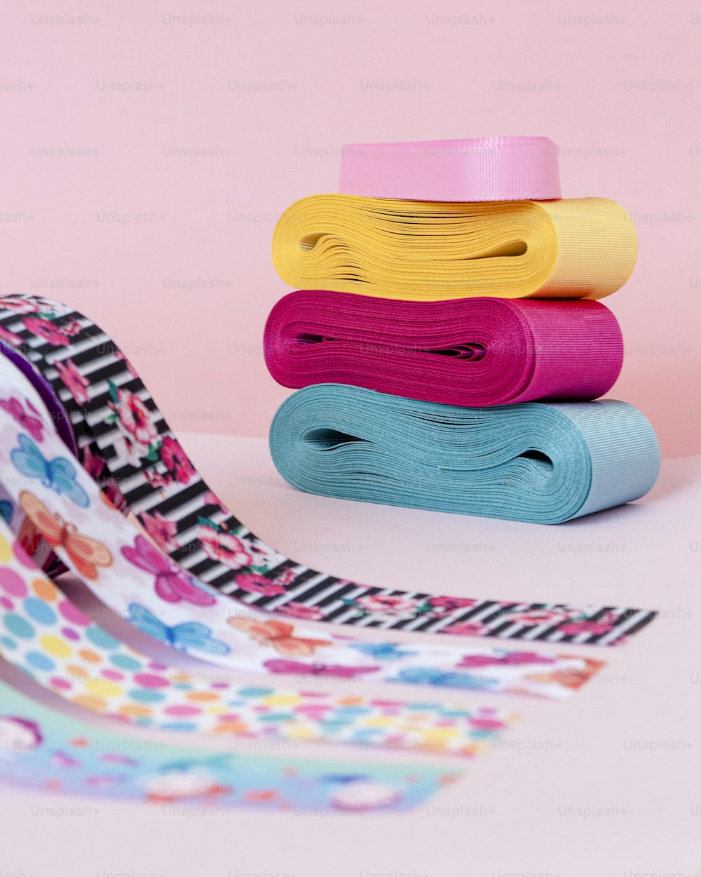 a stack of different colored paper on a table