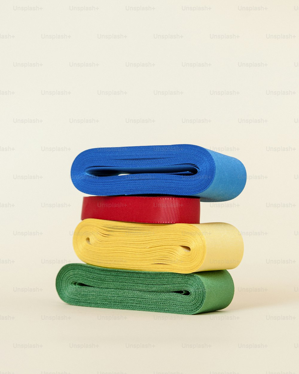 a stack of colorful yoga mats stacked on top of each other