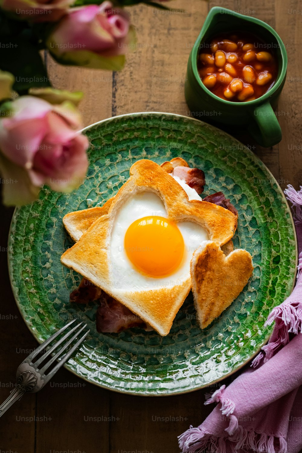 a green plate topped with toast and an egg