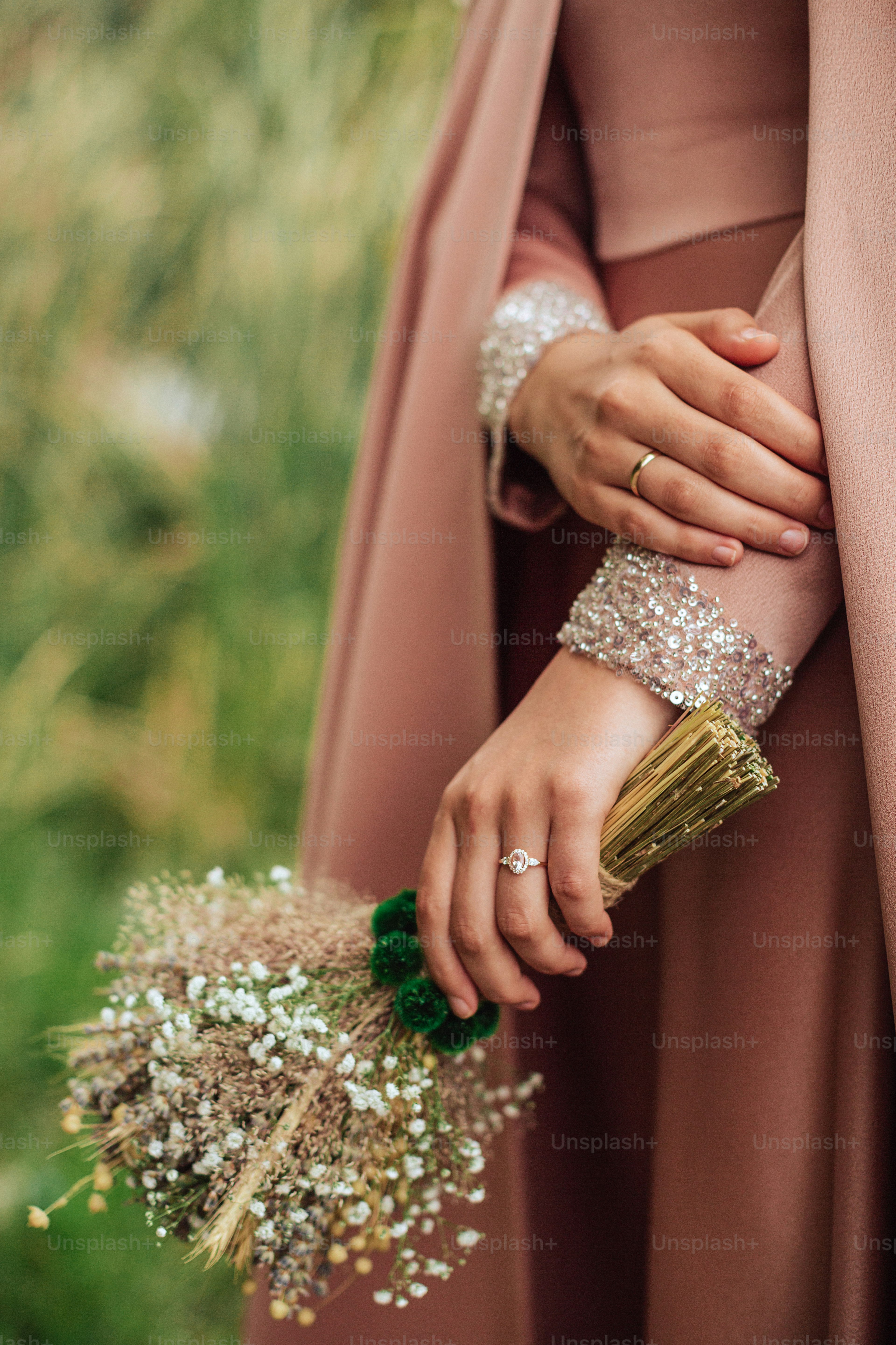 A woman in a pink dress holding a bouquet of flowers photo – Bridesmaid ...