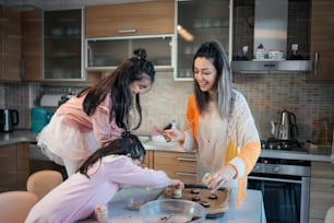 two women in a kitchen preparing food together