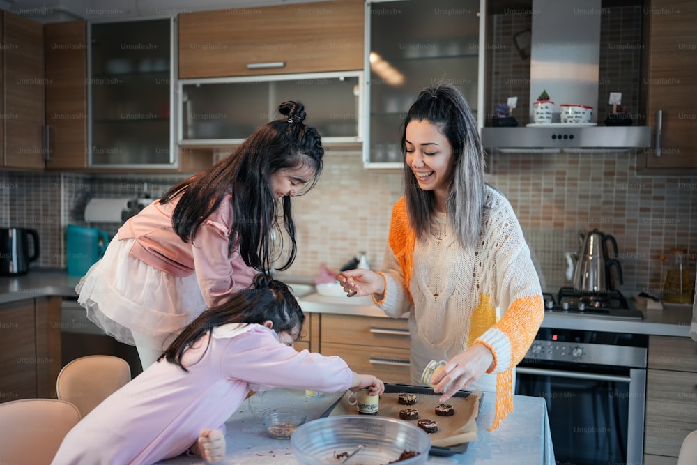 two women in a kitchen preparing food together