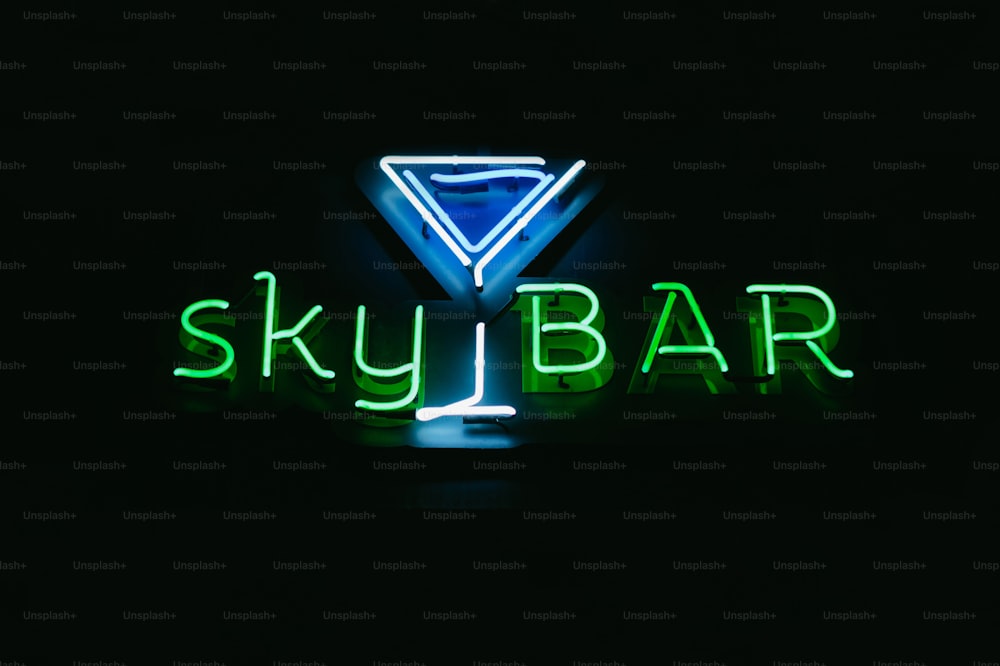 a neon sign that says sky bar in a dark room
