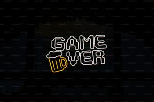 a neon sign that says game over in a dark room