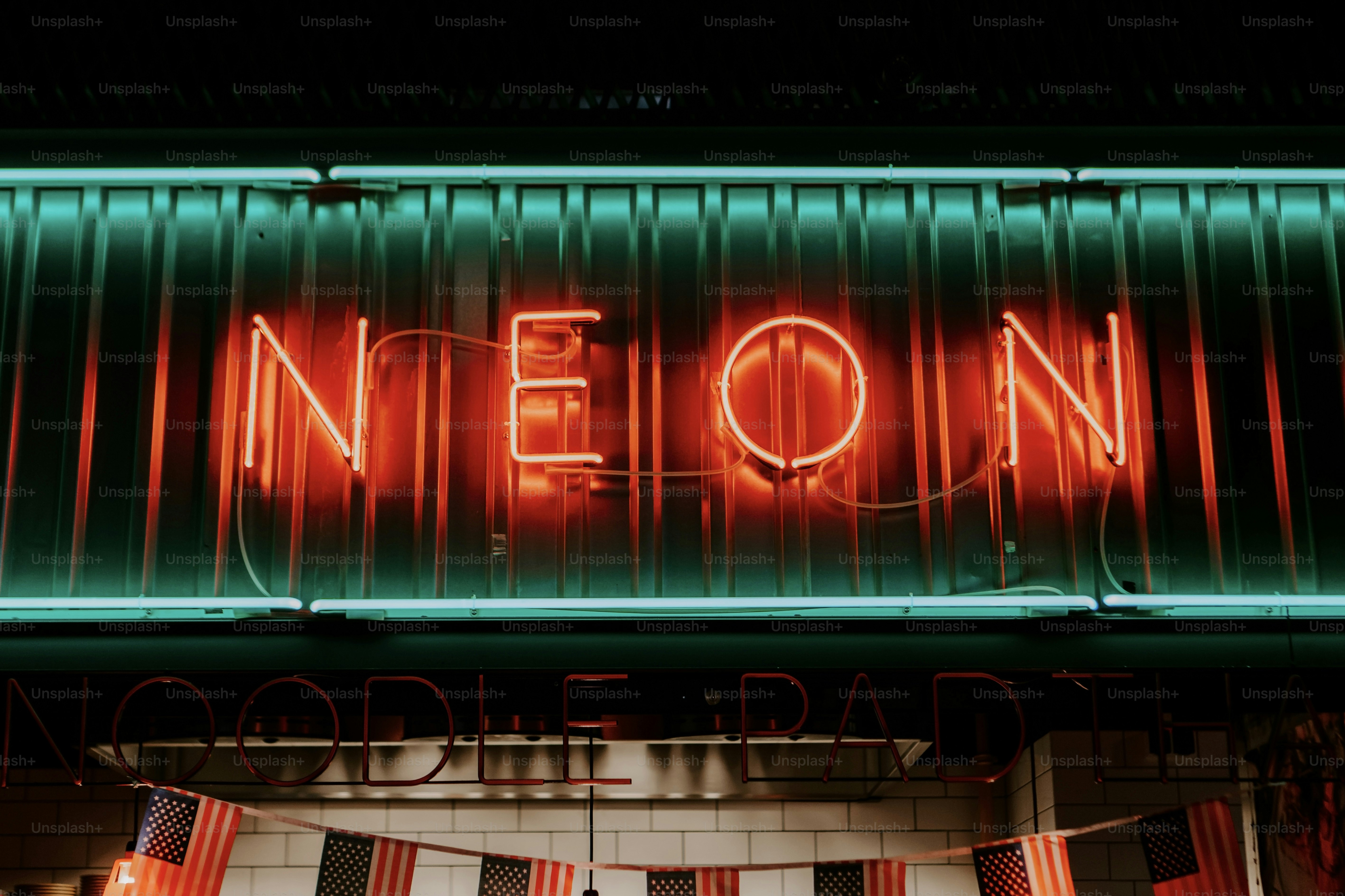 a neon neon sign on the side of a building