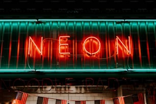a neon neon sign on the side of a building