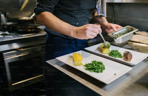 a chef is preparing food in a kitchen