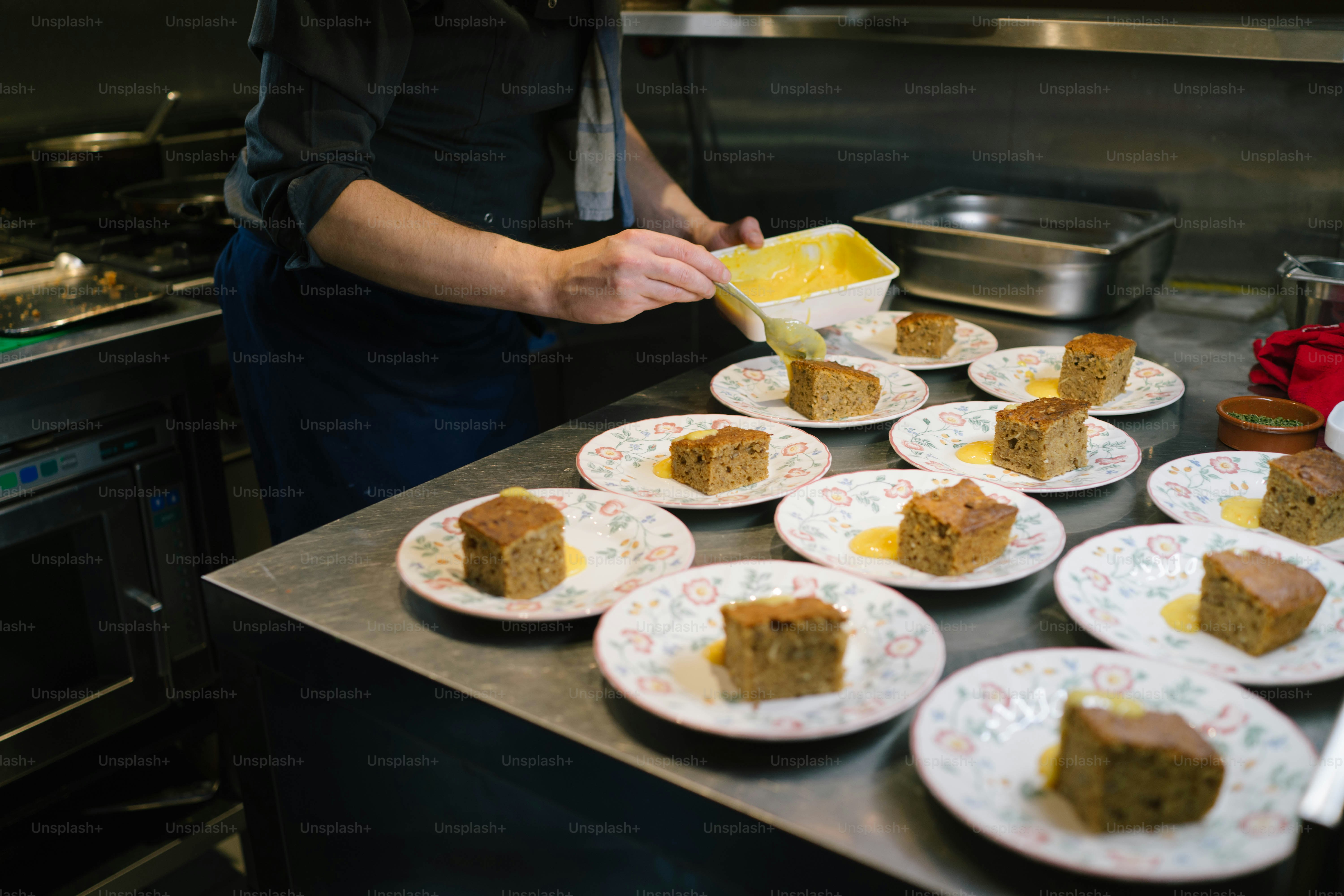a person is putting a piece of cake on a plate