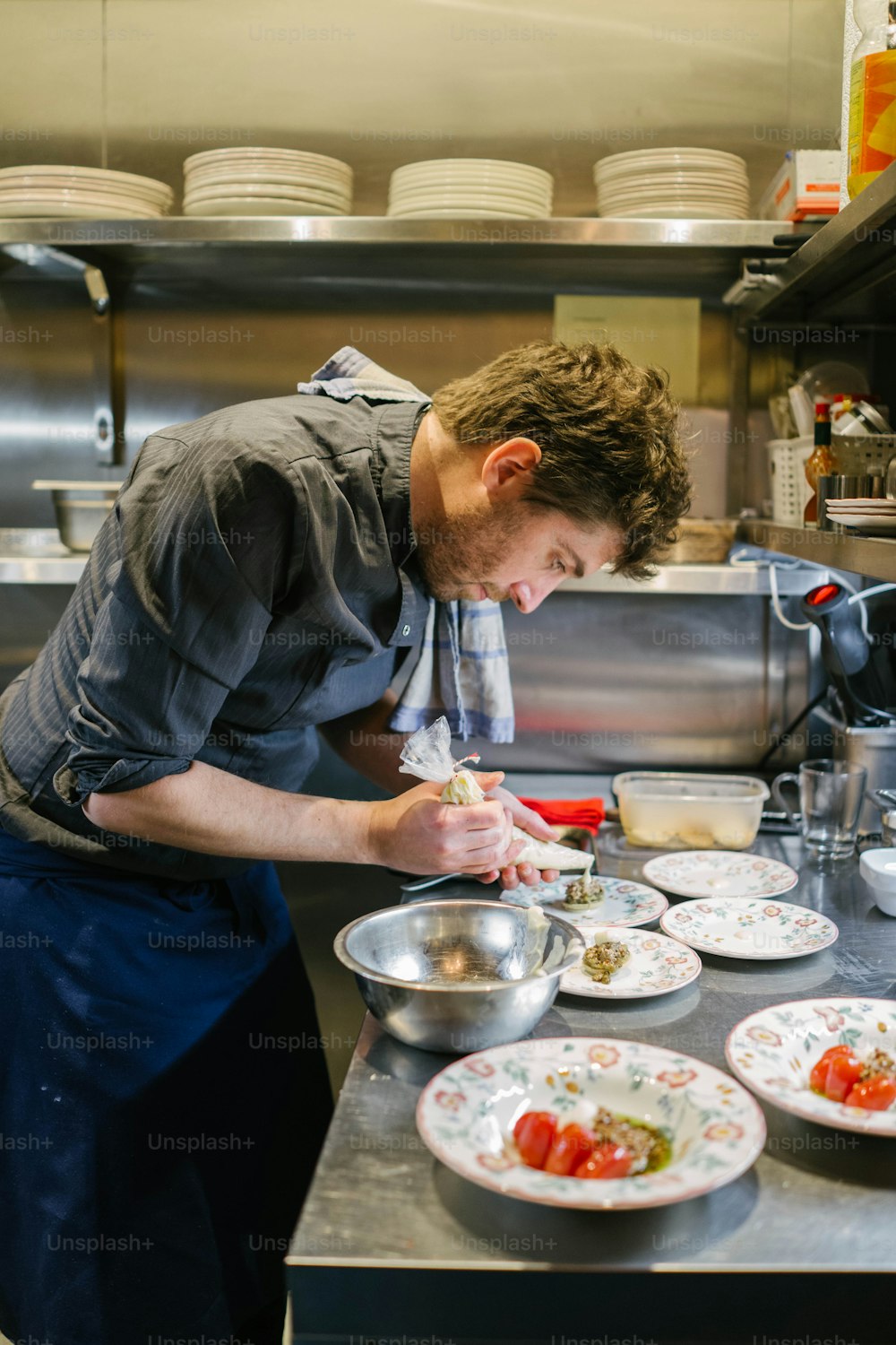 a man is preparing food in a kitchen