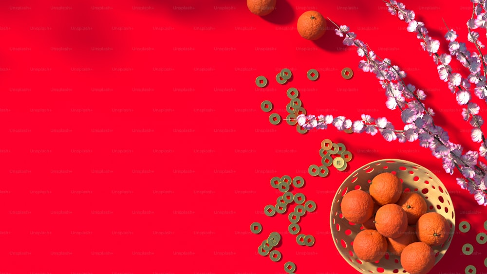 a bowl of oranges and beads on a red surface