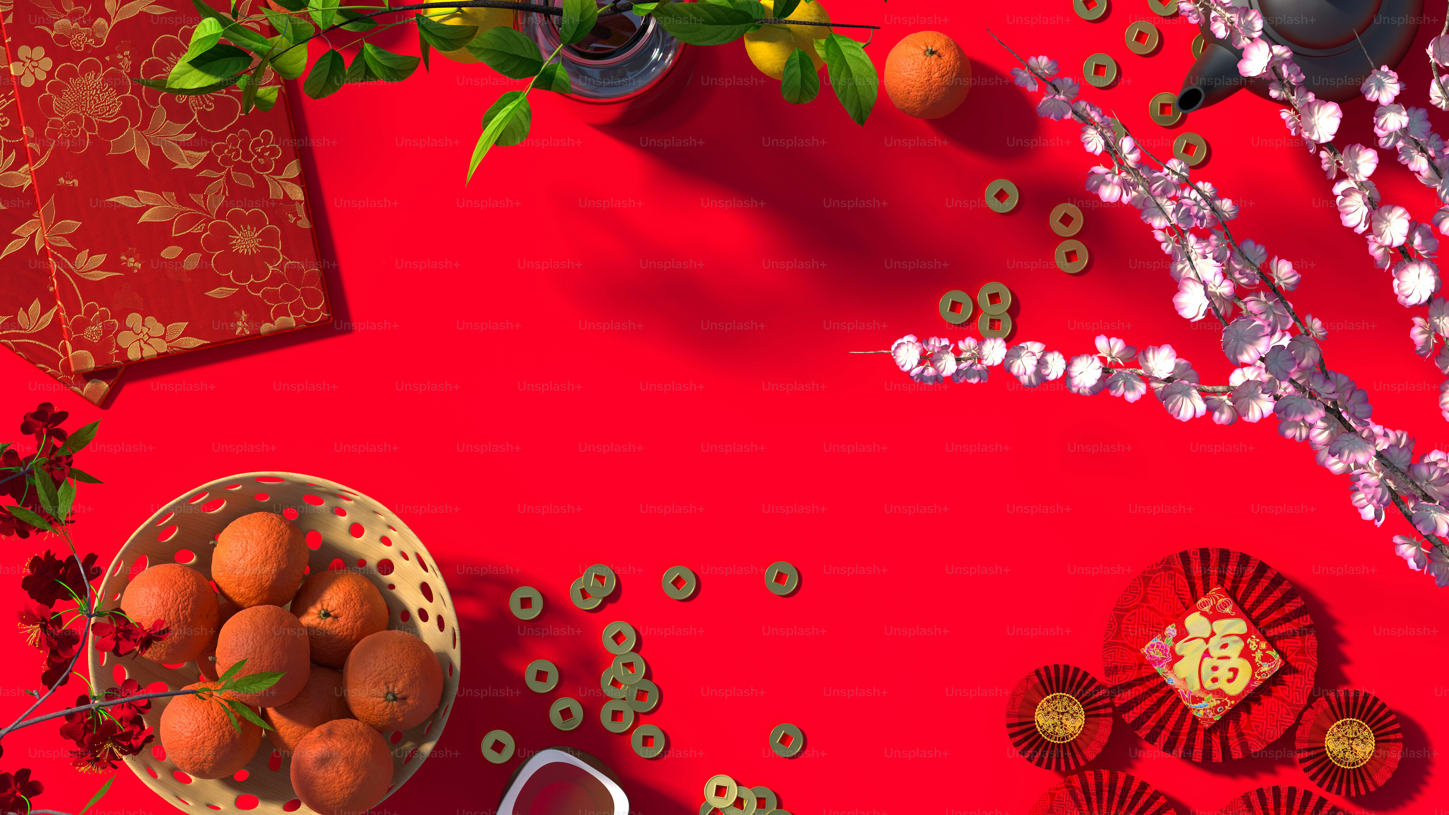 a bowl of oranges on a red table