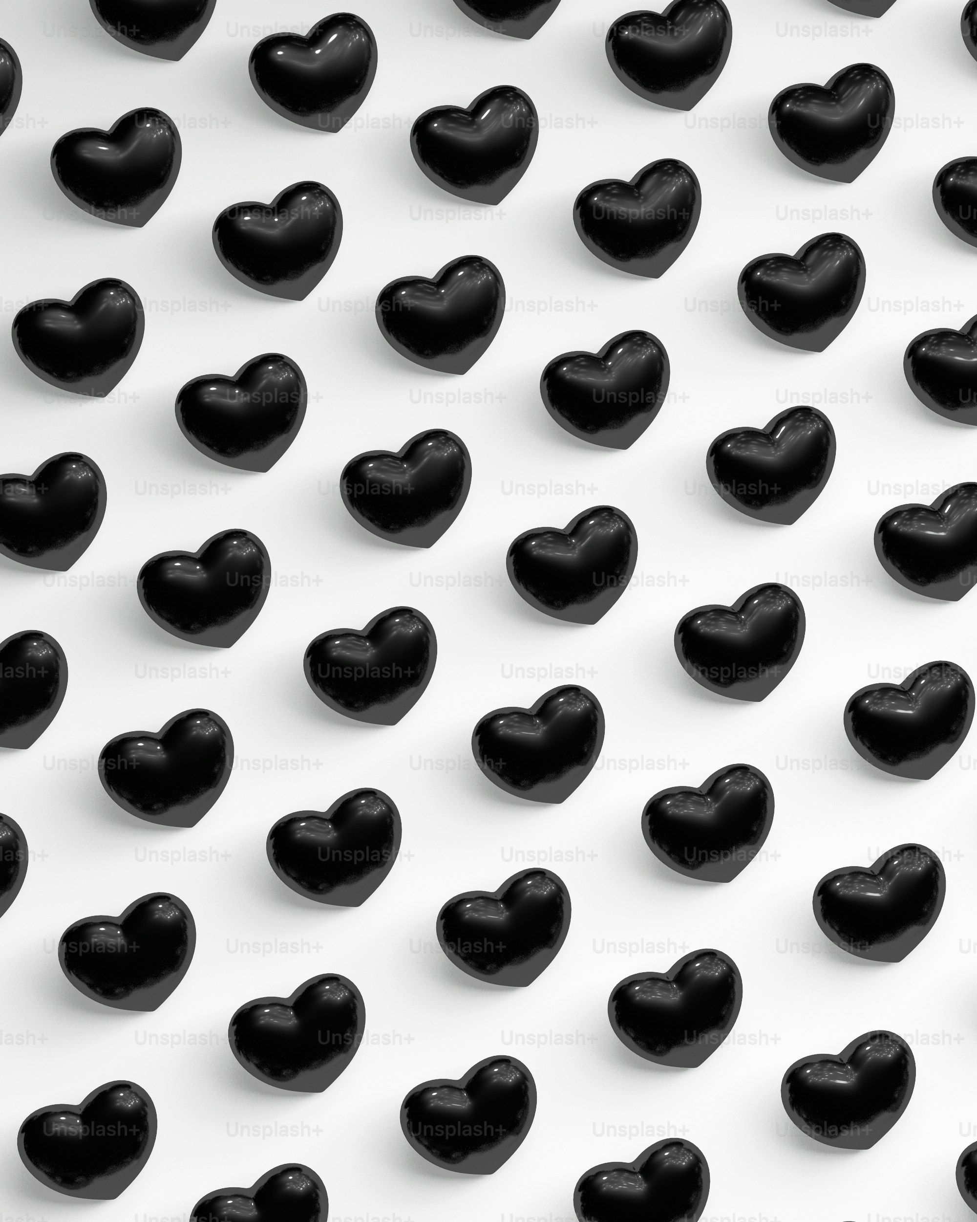 a group of black hearts on a white background