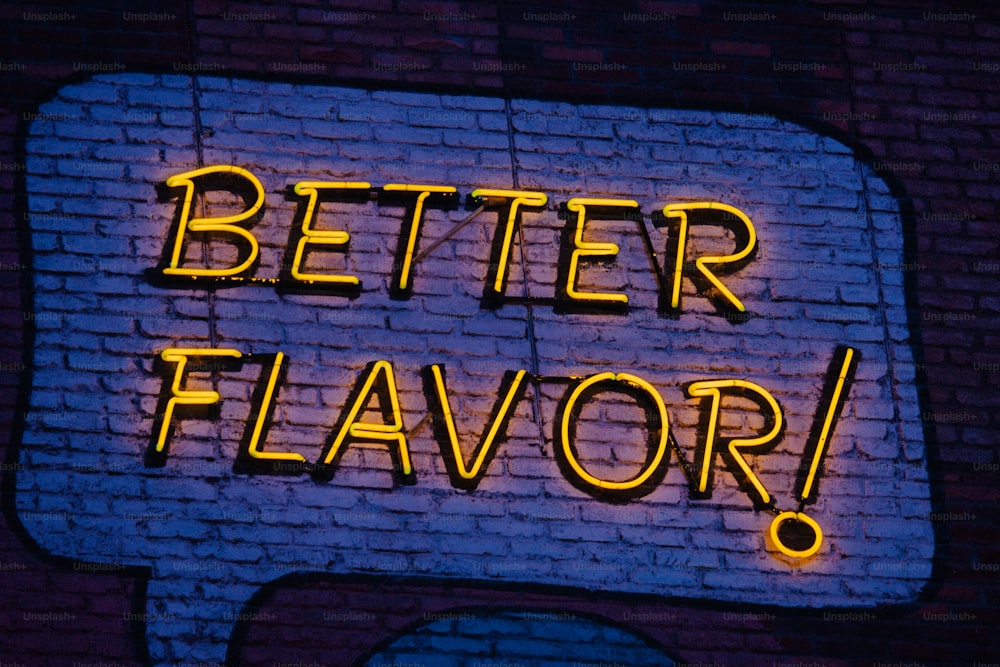 a neon sign that says better flavor on a brick wall