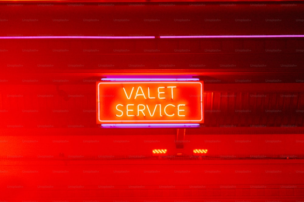 a neon sign that reads valet service