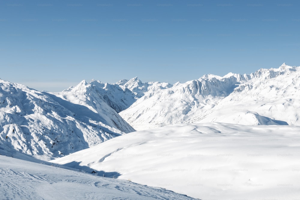 a man riding skis on top of a snow covered slope