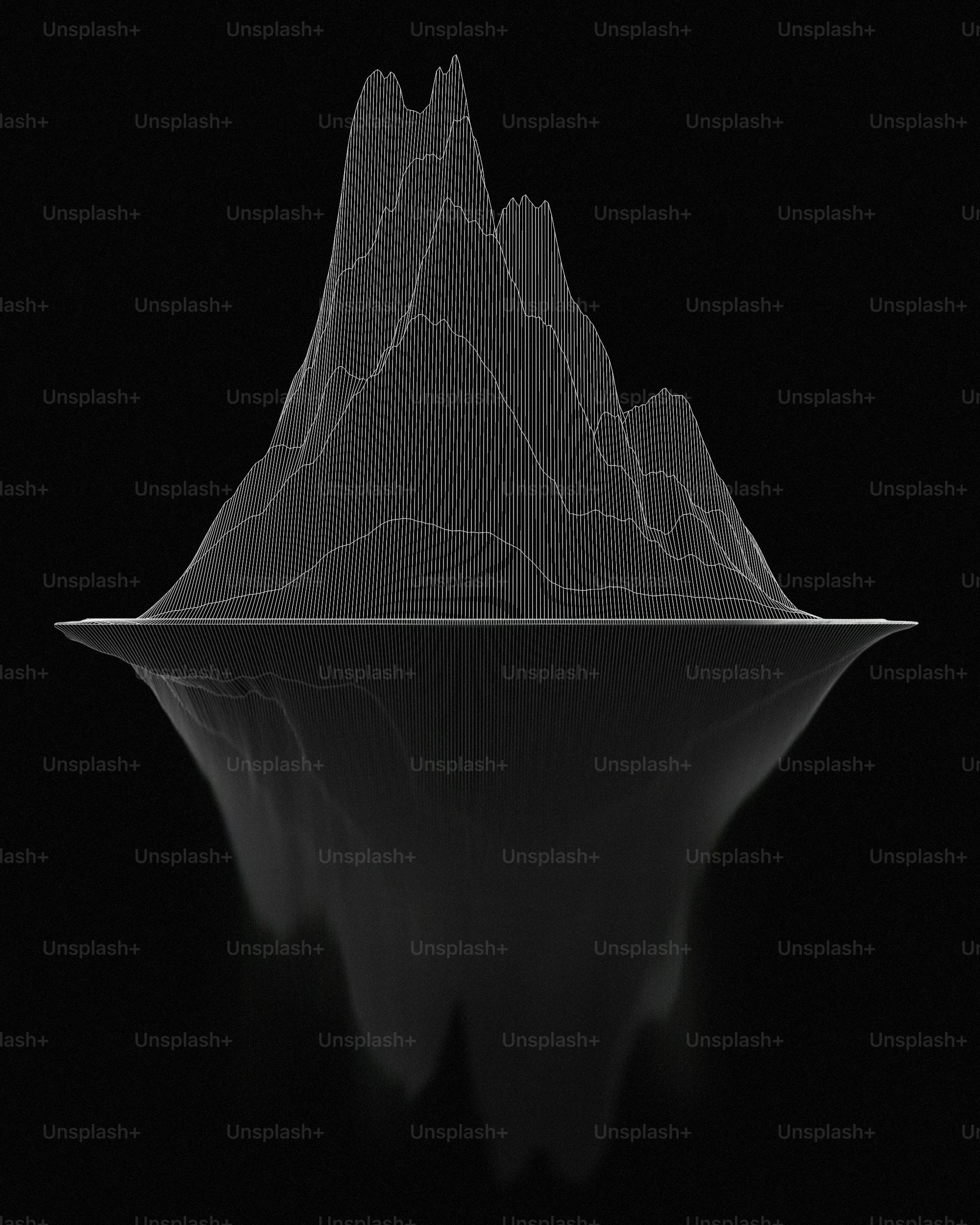 a black and white photo of a mountain